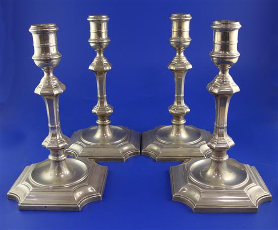 A set of four Edwardian 18th century style silver candlesticks by Hawkesworth, Eyre & Co, 74 oz.